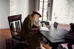 copywriter woman at desk writing